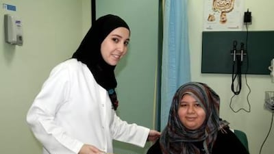 Clinical co-ordinator Salma Al Nabulsi with her patient Afnan Al Thaqafi, who suffers from obesity.
