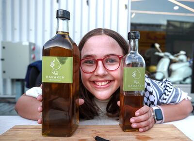 Tamara Mehelba, 11, at the Barakeh Olive Oil stall. Victor Besa / The National