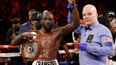 Terence Crawford poses for photographers after defeating Shawn Porter by TKO in a welterweight title boxing match Saturday, November 20, 2021, in Las Vegas. AP Photo