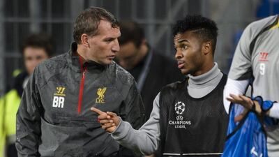 Daniel Sturridge talks with Liverpool manager Brendan Rodgers during a team training session on Tuesday ahead of their Wednesday Champions League match against FC Basel. Fabrice Coffrini / AFP / September 30, 2014