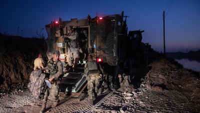 The first group of Turkish infantry prepare to enter Syria on the border between Turkey and Syria on October 9 in Akcakale, Turkey. Getty Images