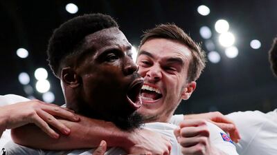 Tottenham Hotspur's Serge Aurier celebrates scoring their third goal against Olympiakos with Harry Winks. Reuters