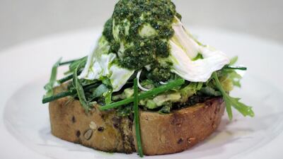 Basil pesto and avocado with poached eggs. Courtesy Jones the Grocer