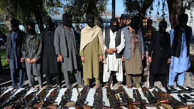 Alleged Taliban fighters and other militants stand handcuffed while being presented to the media on March 6, 2018. AFP
