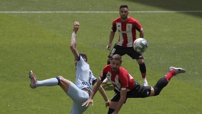 Athletic Bilbao's Yerai Alvarez, right, and Saul Niguez of Athletic Bilbao battle for the ball. EPA