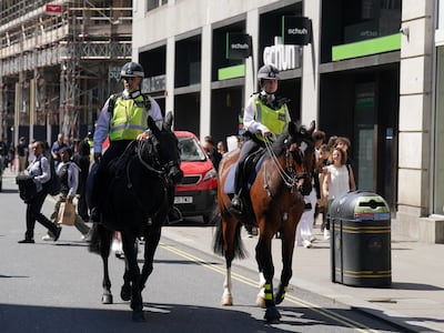 Police officers on Oxford Street, central London. PA