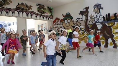 Children from the German International School in Abu Dhabi rehearse for the 40th anniversary celebrations. Ravindranath K / The National