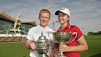Lloyd and Peters hold aloft their well-deserved silverware.
