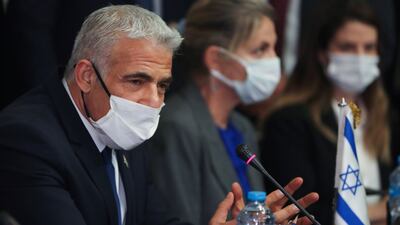 Mr Lapid at the meeting at Tahrir Palace. Reuters