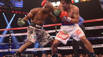 Timothy Bradley and Manny Pacquiao exchange blows in 2014. AFP