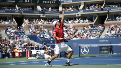 Kei Nishikori lines up a serve to Novak Djokovic during their semi-final match in New York. Mike Segar / Reuters