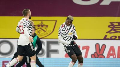 Pogba, right, dances as he celebrates scoring. AP