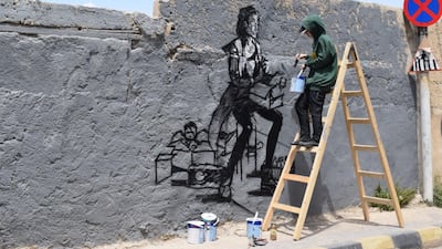 A street art work in progress on the streets of Amman. Courtesy Baladk Project