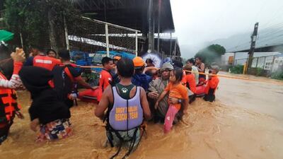 As the typhoon hit, authoritities were warning residents to avoid large crowds as the first cases of the Omicron coronavirus variant were reported. Photo: AP Photo