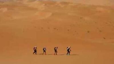 A team treks through the Empty Quarter during the first challenge.
