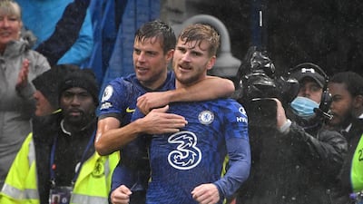 Chelsea's German striker Timo Werner (R) celebrates with teammates after he scores his team's second goal during the English Premier League football match between Chelsea and Southampton at Stamford Bridge in London on October 2, 2021. (Photo by JUSTIN TALLIS / AFP) / RESTRICTED TO EDITORIAL USE. No use with unauthorized audio, video, data, fixture lists, club/league logos or 'live' services. Online in-match use limited to 120 images. An additional 40 images may be used in extra time. No video emulation. Social media in-match use limited to 120 images. An additional 40 images may be used in extra time. No use in betting publications, games or single club/league/player publications. /