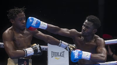 Richman Ashelley from Ghana hitting Keyshawn Davis at the Rotunda, Ceasar's Palace, Bluewaters Island, Dubai. Leslie Pableo for The National