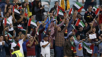 UAE football fans cheer on their side during the Emiratis' 4-1 win over Qatar on Sunday at the Asian Cup in Australia. Tim Wimborne / Reuters