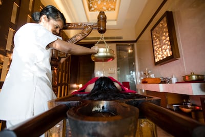 Shirodhara, in which warm oil is trickled over the forehead to induce a state of calm, dates back millennia. Photo: Ananda in the Himalayas