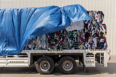 Every day, the 100,000 square foot facility in Sharjah handles 60 tonnes of used clothing for export to Africa. Antonie Robertson / The National