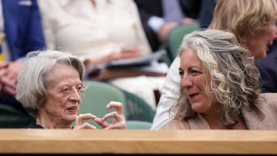 Actress Dame Maggie Smith sits with her daughter-in-law Suki Stephens in the royal box. AP