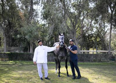 Emirati trainer Ali Rashid Al Raihe with his assistant Jilani Siddiqi at Grandstand Stables. Reem Mohammed / The National