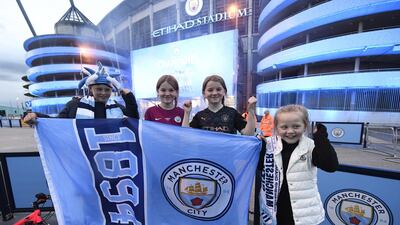 Manchester City supporters celebrate their club winning the Premier League title. EPA