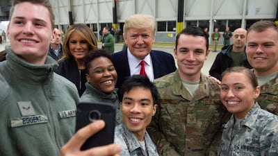 US President Donald Trump and first lady Melania Trump greet members of the US military during a stop at Ramstein Air Base in Germany. AFP
