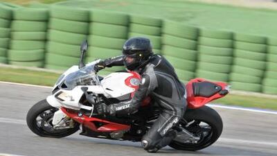 David Booth cornering on BMW's latest, greatest superbike: the S1000RR. It's been slightly improved but still manages to shock with its sheer speed - it's the world's fastest motorcycle. Courtesy BMW