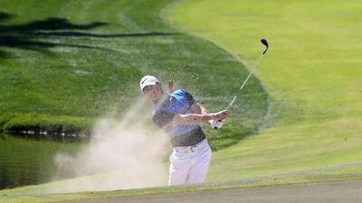 Rory McIlroy of Northern Ireland plays a shot during the final round of the 2016 Dubai Desert Classic at the Emirates Golf Club in Dubai on February 7, 2016. AFP / KARIM SAHIB