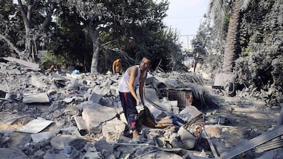 A Palestinian searches for belongings among the rubble of a house that police said was destroyed in an Israeli air strike in Rafah. Ibraheem Abu Mustafa (/ Reuters