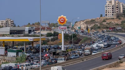 A general view of a petrol station on a Lebanese highway as cars come from every direction to try and fill their tanks with petrol, in the coastal town of Jiyeh. AP