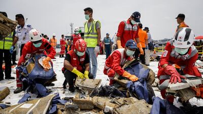 Indonesian rescuers sort recovered debris of Lion Air flight JT610 before loading onto a lorry for investigation by the National Transportation Safety Committee at Tanjung Priok port in Jakarta. All photos by EPA