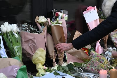 Flowers are laid in front of the Bataclan concert hall as Paris marks the 10th anniversary of terrorist attacks that killed 132 people. AP