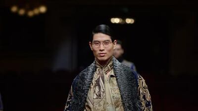 Dramatic brocade capes and daywear pyjama suits emblazoned with playbill posters from Verdi's operas characterised Alta Sartoria. Courtesy Dolce and Gabbana