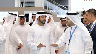 Sheikh Hamdan bin Mohammed, Crown Prince of Dubai, inspects the property models at Cityscape Global. Chris Whiteoak / The National