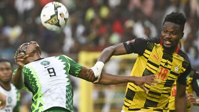 Ghana's Daniel Amartey and Victor Osimhen of Nigeria battle for the ball at the National Stadium in Abuja on March 29, 2022. AFP