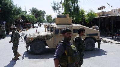 Afghan security forces patrol after a Taliban attack in the city of Farah in May 2018. AFP