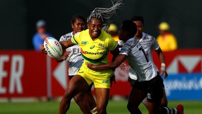 Ellia Green of Australia is tackled by Roela Radiniyavuni of Fiji during day one of the HSBC World Rugby Sevens Series at The Sevens Stadium in Dubai. Getty