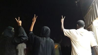 Sudanese demonstrators flash the V-sign for victory during an anti-government protest in the Haj Yousef neighbourhood of the Bahari district in the capital Khartoum. AFP
