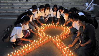 Students in Bengaluru remembering those who have died of cancer. Reuters