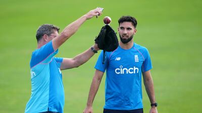 England's Saqib Mahmood with pace bowling coach Jon Lewis during training in Leeds. PA