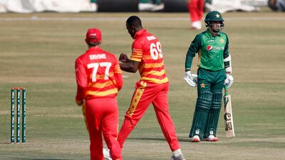 Pakistan batsman Abild Ali, right, after his dismissal by Zimbabwe's Carl Mumba during their first ODI at the Pindi Cricket Stadium in Rawalpindi on Friday. AP