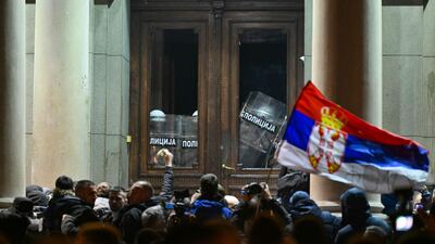 Protesters gather in front of the city council building in Belgrade. AFP