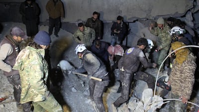 Syrian volunteers search for survivors in the rubble of a village mosque that was hit by an air strike in Aleppo on March 16, 2017. Omar Haj Kadour / AFP