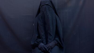 Maya Alleruzzo has won 2nd prize in the 'Contemporary Issues - Stories' category for a series titled 'Islamic State’s Yazidi Survivors'. Yazidi Layla Taloo poses for a portrait in the full-face veil and abaya she wore while enslaved by Islamic State militants, at her home in Sharia, Iraq. Maya Alleruzzo/AP Photo