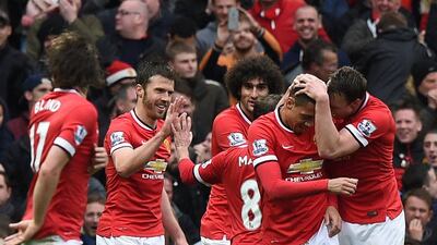 Manchester United have been in fine form of late, while leaders Chelsea have been scrapping out wins. Paul Ellis / AFP