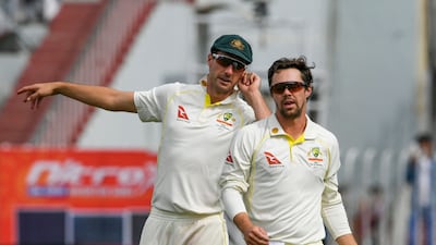 Australia's captain Pat Cummins, left, speaks with Travis Head. AFP