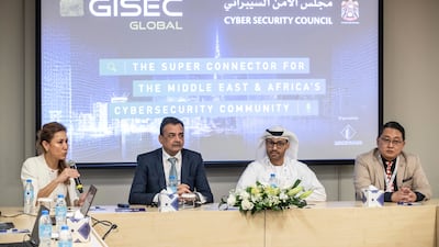 Dr Mohamed Al Kuwaiti, second from right, head of cyber security for the UAE government; with Trixie LohMirmand, executive vice president of events management at Dubai World Trade Centre; Sanjeev Walia, founder and chief executive of Spire Solutions; and Aloysius Cheang, chief security officer for the UAE at Huawei Technologies. They spoke on Monday at a press conference during Gisec Global 2022, held at Dubai World Trade Centre. Antonie Robertson / The National
