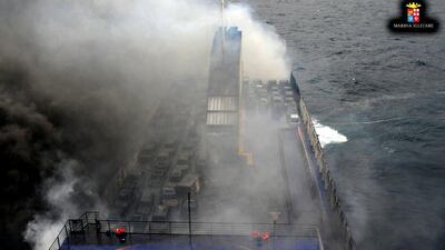 Desperate passengers pleaded by mobile phone live on TV to be saved from a burning ferry adrift off Albania as rescuers battled gale-force winds and billowing smoke to get to them. AFP Photo / Ho / Marina Militare
